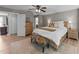 Comfortable bedroom featuring neutral decor, hardwood floors, and a view of the hallway at 112 Pearsall Farm Ln, Clayton, NC 27527