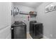 This laundry room comes with modern, stainless steel, front-loading washer and dryer at 112 Pearsall Farm Ln, Clayton, NC 27527