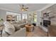 Cozy living room with a stone fireplace, plush sofa, and plenty of natural light at 112 Pearsall Farm Ln, Clayton, NC 27527