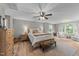 Bright and airy main bedroom features a sitting area, hardwood floors and natural lighting at 112 Pearsall Farm Ln, Clayton, NC 27527