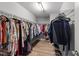 Spacious walk-in closet with metal shelving and ample storage for clothes and accessories at 112 Pearsall Farm Ln, Clayton, NC 27527
