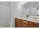 Bathroom featuring double sink vanity, framed mirrors, and a separate shower and toilet area at 113 Market Cross Ct, Holly Springs, NC 27540