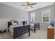 Comfortable bedroom showcasing twin beds, ample natural light from the sun-lit windows, and neutral paint at 113 Market Cross Ct, Holly Springs, NC 27540