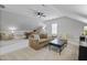 Spacious bonus room with seating, ceiling fan, neutral carpet and natural light from the window at 113 Market Cross Ct, Holly Springs, NC 27540