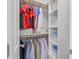 Organized closet features rods, shelving and baskets for optimal storage and organization at 113 Market Cross Ct, Holly Springs, NC 27540
