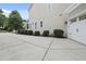 Exterior shot showcasing the home's siding, landscaping, driveway, and garage at 113 Market Cross Ct, Holly Springs, NC 27540
