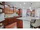 Gourmet kitchen with granite countertops, stainless steel appliances, and custom cabinetry at 113 Market Cross Ct, Holly Springs, NC 27540