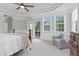 The main bedroom features tray ceilings, a cozy reading nook, and a private balcony entrance at 113 Market Cross Ct, Holly Springs, NC 27540