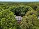 Aerial view of home secluded within a dense canopy of trees at 116 Berry Hill Dr, Raleigh, NC 27615