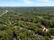 Wide aerial shot of the community located near a forest and highway at 116 Berry Hill Dr, Raleigh, NC 27615
