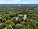 High angle view of a residential neighborhood with many trees at 116 Berry Hill Dr, Raleigh, NC 27615
