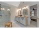 This bathroom has a double vanity and walk-in shower and it leads to the main bedroom at 116 Berry Hill Dr, Raleigh, NC 27615