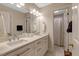 Bright bathroom featuring a double vanity with a white countertop at 116 Berry Hill Dr, Raleigh, NC 27615