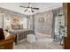 Comfortable bedroom with neutral walls, carpet, ceiling fan, and ample natural light at 116 Berry Hill Dr, Raleigh, NC 27615
