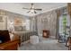 Serene bedroom with soft gray walls, carpet, and a ceiling fan at 116 Berry Hill Dr, Raleigh, NC 27615