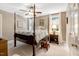 This bedroom features neutral walls, carpet and a four post bed with bedding at 116 Berry Hill Dr, Raleigh, NC 27615