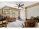 Neutral bedroom with a ceiling fan, double door closet and natural light at 116 Berry Hill Dr, Raleigh, NC 27615