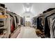 Walk-in closet with clothing racks and storage for shoes, purses and other accessories at 116 Berry Hill Dr, Raleigh, NC 27615