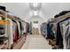 Walk-in closet with clothing racks and storage for shoes, purses and other accessories at 116 Berry Hill Dr, Raleigh, NC 27615