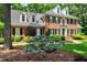 Beautiful brick home with manicured landscaping and charming entrance at 116 Berry Hill Dr, Raleigh, NC 27615