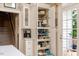 Kitchen pantry and storage featuring pull-out shelves and a coffee bar at 116 Berry Hill Dr, Raleigh, NC 27615