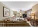 Comfortable living room featuring a cozy sofa, ceiling fan and a view of the outdoors at 116 Berry Hill Dr, Raleigh, NC 27615