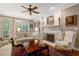 Cozy living room with a fireplace, built-in shelving, and comfortable seating at 116 Berry Hill Dr, Raleigh, NC 27615