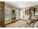 Sunlit living room boasting hardwood floors, shutters, and stylish decor at 116 Berry Hill Dr, Raleigh, NC 27615
