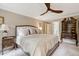 Spacious bedroom with a ceiling fan and an adjacent ensuite bathroom at 116 Berry Hill Dr, Raleigh, NC 27615