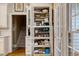 Well-organized pantry with pull-out shelves and ample storage space near the kitchen at 116 Berry Hill Dr, Raleigh, NC 27615