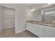 Bathroom features a granite double vanity, framed mirror, and walk-in closet for ample storage at 119 Blossom Creek Dr, Garner, NC 27529