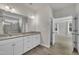Bright bathroom features granite double vanity, framed mirror, and shower room at 119 Blossom Creek Dr, Garner, NC 27529