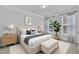 Comfortable bedroom features natural light, neutral tones, and simple decor for a peaceful ambiance at 119 Blossom Creek Dr, Garner, NC 27529