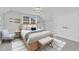 Charming bedroom features a window, a comfortable bed, and stylish decor for a relaxing ambiance at 119 Blossom Creek Dr, Garner, NC 27529
