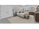 Comfortable bedroom offers soft lighting, a large window, and neutral tones for a serene retreat at 119 Blossom Creek Dr, Garner, NC 27529