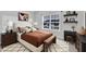 This stylish bedroom offers a window view, unique décor, and a cozy ambiance for comfortable living at 119 Blossom Creek Dr, Garner, NC 27529