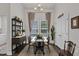 Charming dining room with decorative shelf, modern table and chairs, natural lighting, and simple decor at 119 Blossom Creek Dr, Garner, NC 27529