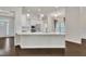 Bright kitchen island with a white countertop and stainless steel appliances at 119 Blossom Creek Dr, Garner, NC 27529
