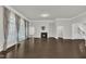 Open-concept space with hardwood floors, fireplace, and access to the backyard at 119 Blossom Creek Dr, Garner, NC 27529