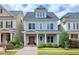 Charming two-story home with a cozy front porch, beautiful door and manicured landscaping at 1217 Chalk Maple Dr, Cary, NC 27519