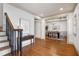 Grand foyer with hardwood floors, staircase, and a view of the elegant dining room at 1217 Chalk Maple Dr, Cary, NC 27519