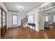 Welcoming foyer with hardwood floors, staircase, and a glimpse into the living room at 1217 Chalk Maple Dr, Cary, NC 27519