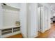 Hallway with mudroom-style bench and coat hooks, leading to the kitchen at 1217 Chalk Maple Dr, Cary, NC 27519