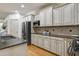Well-appointed kitchen with stainless steel appliances, granite countertops, and custom cabinetry at 1217 Chalk Maple Dr, Cary, NC 27519