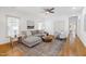 Bright living room with a comfortable couch, area rug, and plenty of natural light at 1217 Chalk Maple Dr, Cary, NC 27519