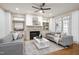 Comfortable living room with a fireplace, built-in shelves, and hardwood floors at 1217 Chalk Maple Dr, Cary, NC 27519