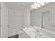 Modern bathroom featuring a sleek vanity with a large mirror and a shower-tub combo at 1217 Solace Way, Rolesville, NC 27571