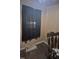 Picture of a bedroom with hardwood floors, dark curtains, and a rocking chair at 1256 Planters St, Rocky Mount, NC 27801