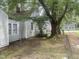 Home with lots of large, mature trees surrounding the property at 1256 Planters St, Rocky Mount, NC 27801