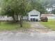 View of the house with a detached garage and a concrete driveway at 1256 Planters St, Rocky Mount, NC 27801